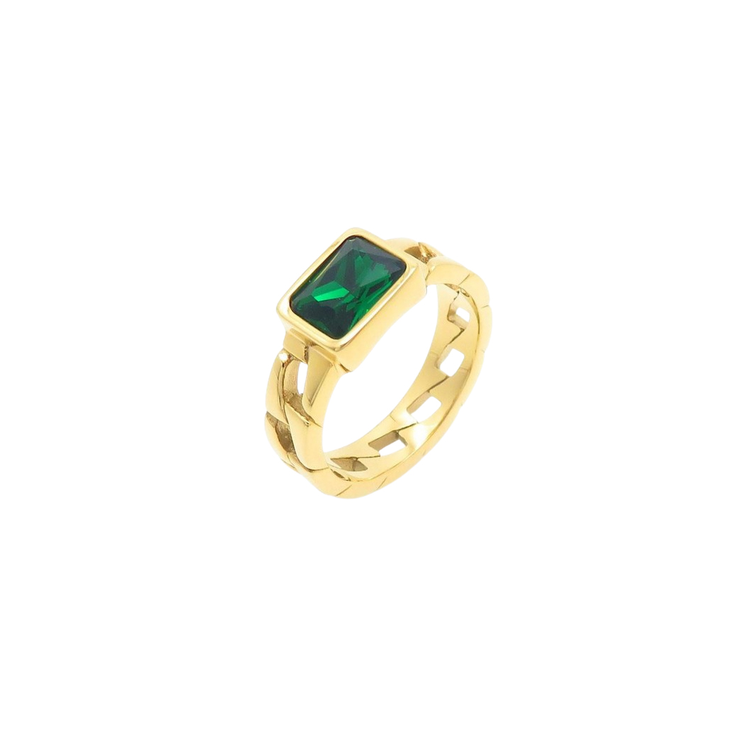 A gold ring with a rectangular green gemstone, featuring a unique cutout design on the band.