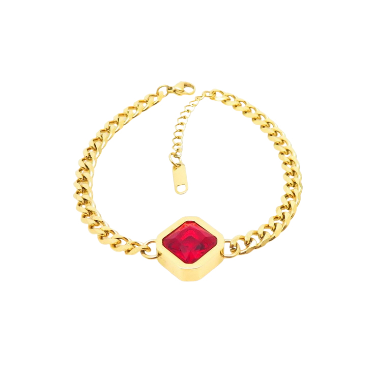 A stunning gold bracelet featuring a deep, red crystal centerpiece, offering a bold and sophisticated look for any occasion.